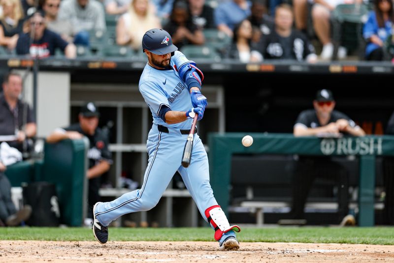 May 27, 2024; Chicago, Illinois, USA; Toronto Blue Jays third baseman Isiah Kiner-Falefa (7) doubles against the Chicago White Sox during the fourth inning at Guaranteed Rate Field. Mandatory Credit: Kamil Krzaczynski-USA TODAY Sports