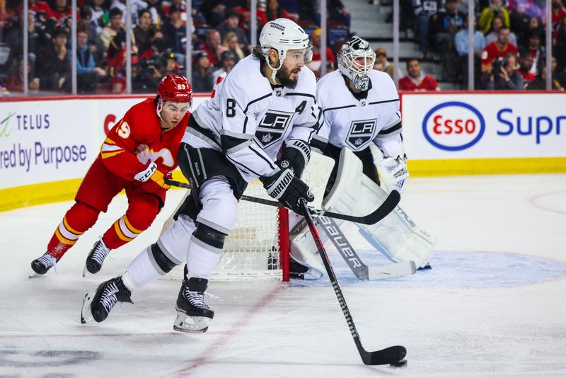 Mar 28, 2023; Calgary, Alberta, CAN; Los Angeles Kings defenseman Drew Doughty (8) controls the puck against the Calgary Flames during the second period at Scotiabank Saddledome. Mandatory Credit: Sergei Belski-USA TODAY Sports