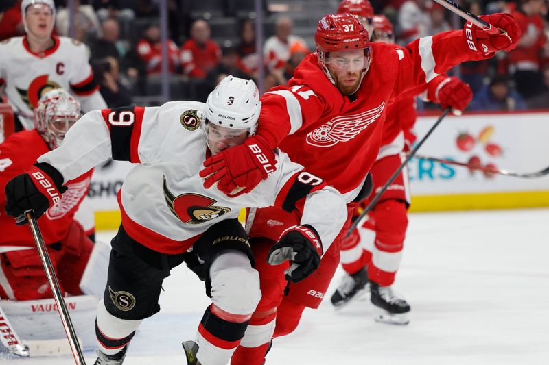 Jan 31, 2024; Detroit, Michigan, USA;  Ottawa Senators center Josh Norris (9) and Detroit Red Wings left wing J.T. Compher (37) fight for position in the first period at Little Caesars Arena. Mandatory Credit: Rick Osentoski-USA TODAY Sports