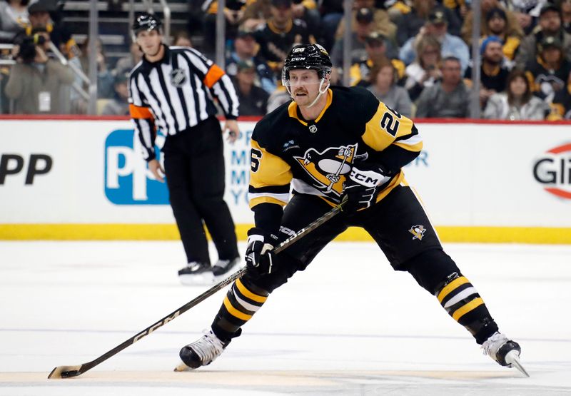 Nov 5, 2022; Pittsburgh, Pennsylvania, USA;  Pittsburgh Penguins defenseman Jeff Petry (26) skates with the puck against the Seattle Kraken during the third period at PPG Paints Arena. Seattle won 3-2. Mandatory Credit: Charles LeClaire-USA TODAY Sports