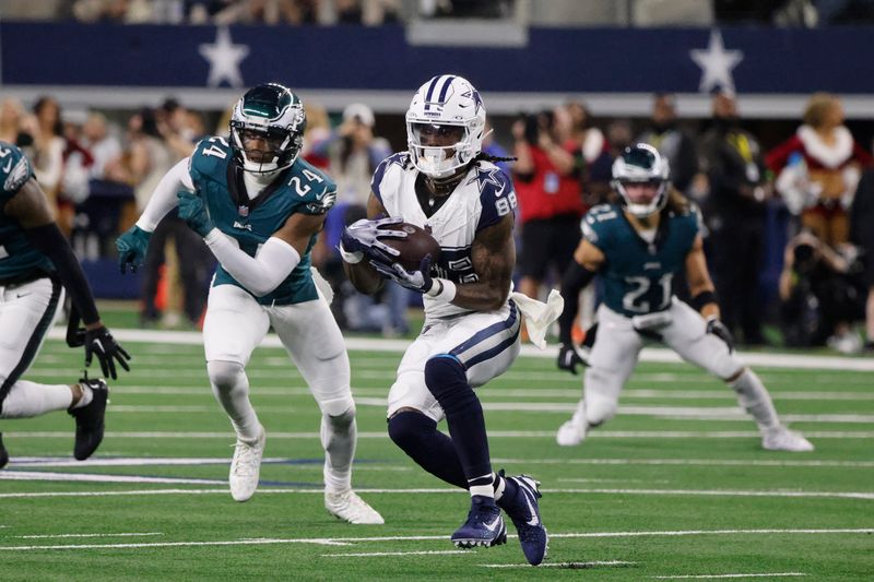 Dallas Cowboys wide receiver CeeDee Lamb (88) catches a pass in front of Philadelphia Eagles cornerback James Bradberry (24) during an NFL Football game in Arlington, Texas, Sunday, Dec. 10, 2023. (AP Photo/Michael Ainsworth)