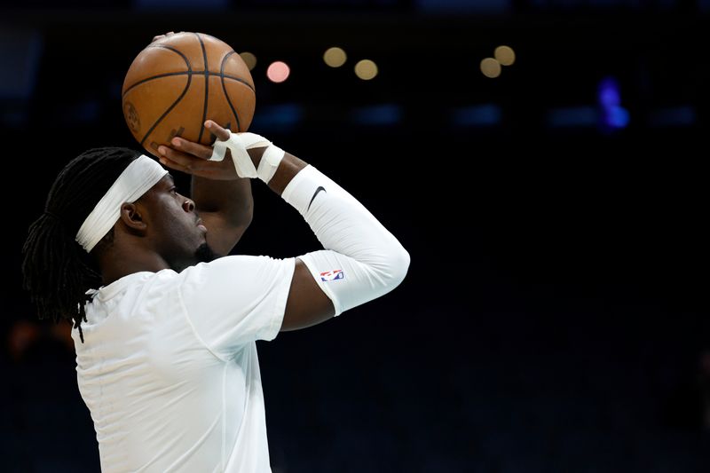 CHARLOTTE, NORTH CAROLINA - DECEMBER 29: Luguentz Dort #5 of the Oklahoma City Thunder warms up prior to the game against the Charlotte Hornets at Spectrum Center on December 29, 2022 in Charlotte, North Carolina. NOTE TO USER: User expressly acknowledges and agrees that, by downloading and or using this photograph, User is consenting to the terms and conditions of the Getty Images License Agreement. (Photo by Jared C. Tilton/Getty Images)