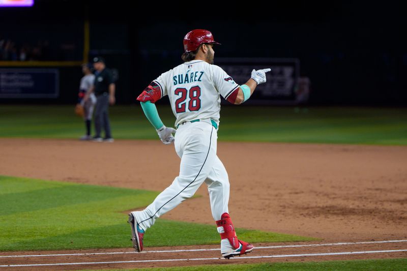 Apr 26, 2025; Phoenix, Arizona, USA;  Arizona Diamondbacks infielder Eugenio Suarez (28) reacts after hitting his fourth home run of the game against the Atlanta Braves during the ninth inning at Chase Field. Mandatory Credit: Allan Henry-Imagn Images