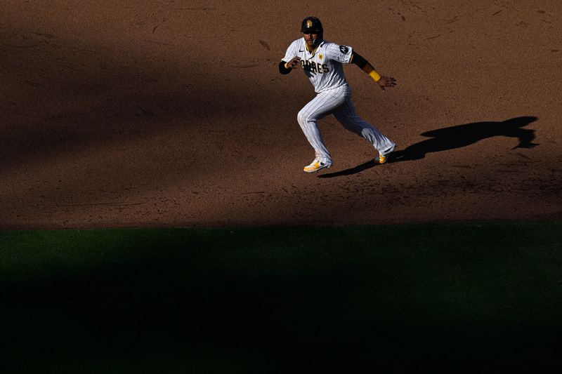 Jun 22, 2024; San Diego, California, USA; San Diego Padres designated hitter Donovan Solano (39) leads off first base during the sixth inning against the Milwaukee Brewers at Petco Park. Mandatory Credit: Orlando Ramirez-USA TODAY Sports