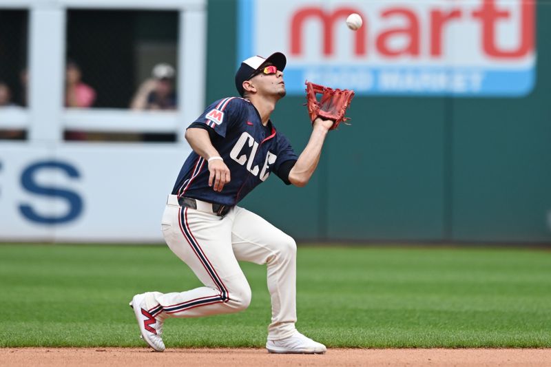 Jun 20, 2024; Cleveland, Ohio, USA; Cleveland Guardians second baseman Andres Gimenez (0) catches a ball hit by Seattle Mariners first baseman Tyler Locklear (not pictured) during the fourth inning at Progressive Field. Mandatory Credit: Ken Blaze-USA TODAY Sports