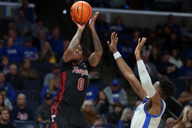 Feb 12, 2023; Memphis, Tennessee, USA; Temple Owls guard Khalif Battle (0) shoots for three during the second half against the Memphis Tigers at FedExForum. Mandatory Credit: Petre Thomas-USA TODAY Sports