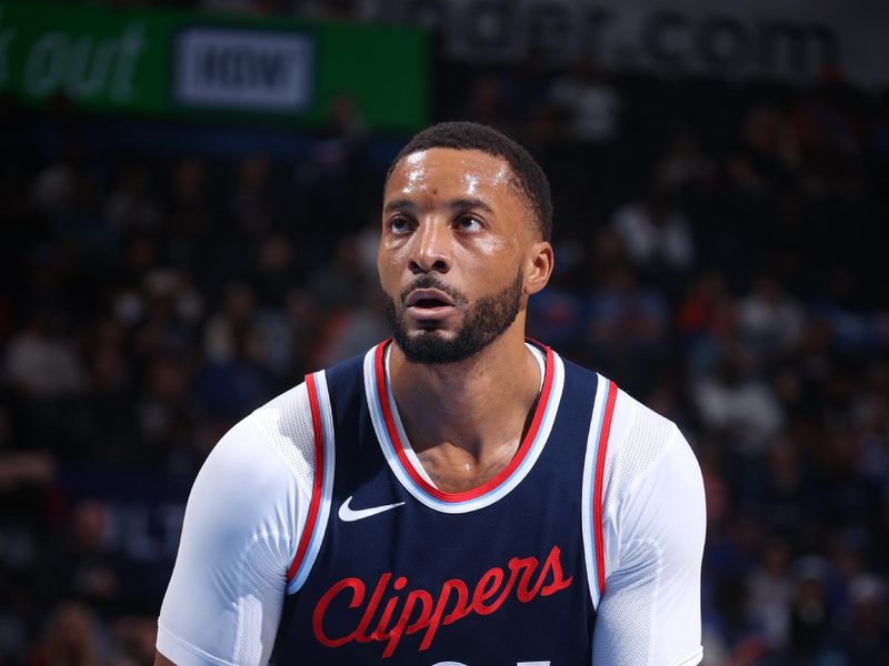 OKLAHOMA CITY, OK - NOVEMBER 11: Norman Powell #24 of the LA Clippers shoots a free throw during the game against the Oklahoma City Thunder on November 11, 2024 at Paycom Center in Oklahoma City, Oklahoma. NOTE TO USER: User expressly acknowledges and agrees that, by downloading and or using this photograph, User is consenting to the terms and conditions of the Getty Images License Agreement. Mandatory Copyright Notice: Copyright 2024 NBAE (Photo by Nathaniel S. Butler/NBAE via Getty Images)