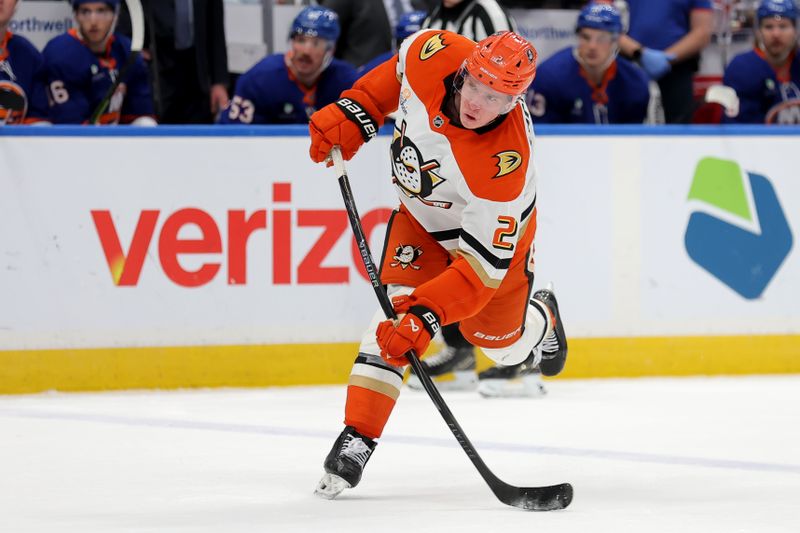 Dec 11, 2025; Elmont, New York, USA; Anaheim Ducks defenseman Jackson Lacombe (2) takes a shot against the New York Islanders during the third period at UBS Arena. Mandatory Credit: Brad Penner-Imagn Images