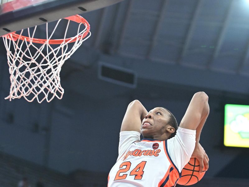 uDec 5, 2023; Syracuse, New York, USA; Syracuse Orange guard Quadir Copeland (24) prepares to dunk the ball against the Cornell Big Red in the second half at the JMA Wireless Dome. Mandatory Credit: Mark Konezny-USA TODAY Sports