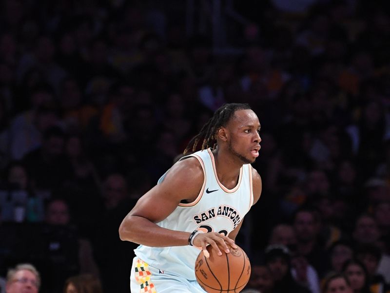 LOS ANGELES, CA - JANUARY 13: Charles Bassey #28 of the San Antonio Spurs dribbles the ball during the game against the Los Angeles Lakers on January 13, 2025 at Crypto.Com Arena in Los Angeles, California. NOTE TO USER: User expressly acknowledges and agrees that, by downloading and/or using this Photograph, user is consenting to the terms and conditions of the Getty Images License Agreement. Mandatory Copyright Notice: Copyright 2025 NBAE (Photo by Noah Graham/NBAE via Getty Images)