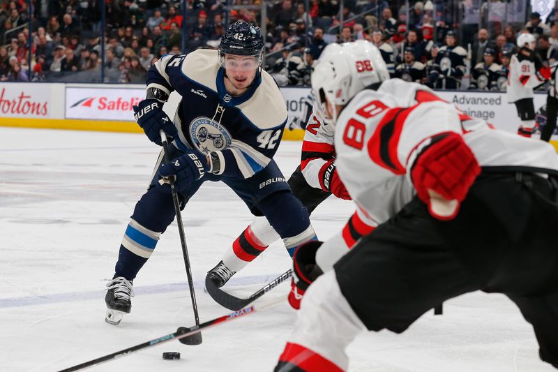 Jan 19, 2024; Columbus, Ohio, USA; Columbus Blue Jackets center Alexander Texier (42) looks to pass against the New Jersey Devils during the third period at Nationwide Arena. Mandatory Credit: Russell LaBounty-USA TODAY Sports