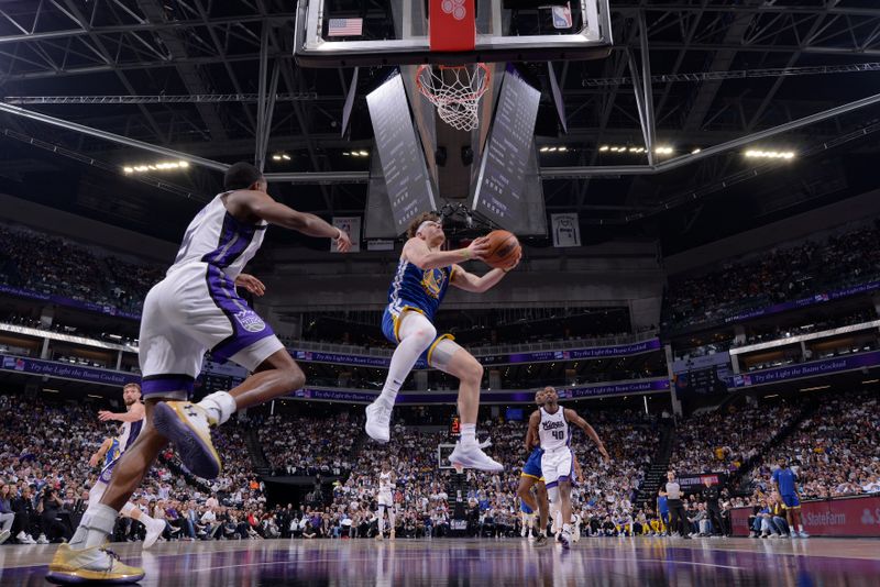 SACRAMENTO, CA - APRIL 16: Brandin Podziemski #2 of the Golden State Warriors drives to the basket during the game against the Sacramento Kings during the 2024 Play-In Tournament on April 16, 2024 at Golden 1 Center in Sacramento, California. NOTE TO USER: User expressly acknowledges and agrees that, by downloading and or using this Photograph, user is consenting to the terms and conditions of the Getty Images License Agreement. Mandatory Copyright Notice: Copyright 2024 NBAE (Photo by Rocky Widner/NBAE via Getty Images)