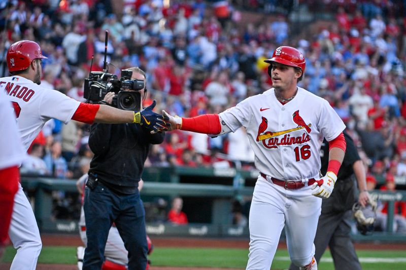 May 3, 2023; St. Louis, Missouri, USA;  St. Louis Cardinals designated hitter Nolan Gorman (16) is congratulated by third baseman Nolan Arenado (28) after hitting a solo home run against the Los Angeles Angels during the first inning at Busch Stadium. Mandatory Credit: Jeff Curry-USA TODAY Sports