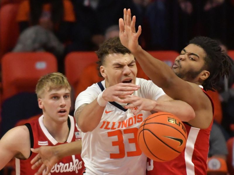 Jan 31, 2023; Champaign, Illinois, USA; Illinois Fighting Illini forward Coleman Hawkins (33) loses the ball as Nebraska Cornhuskers forward Derrick Walker (13) defends during the second half at State Farm Center. Mandatory Credit: Ron Johnson-USA TODAY Sports