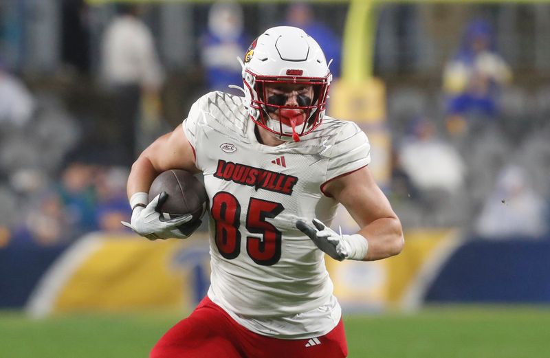 Oct 14, 2023; Pittsburgh, Pennsylvania, USA; Louisville Cardinals tight end Nate Kurisky (85) runs after a catch against the Pittsburgh Panthers during the second quarter at Acrisure Stadium. Mandatory Credit: Charles LeClaire-USA TODAY Sports