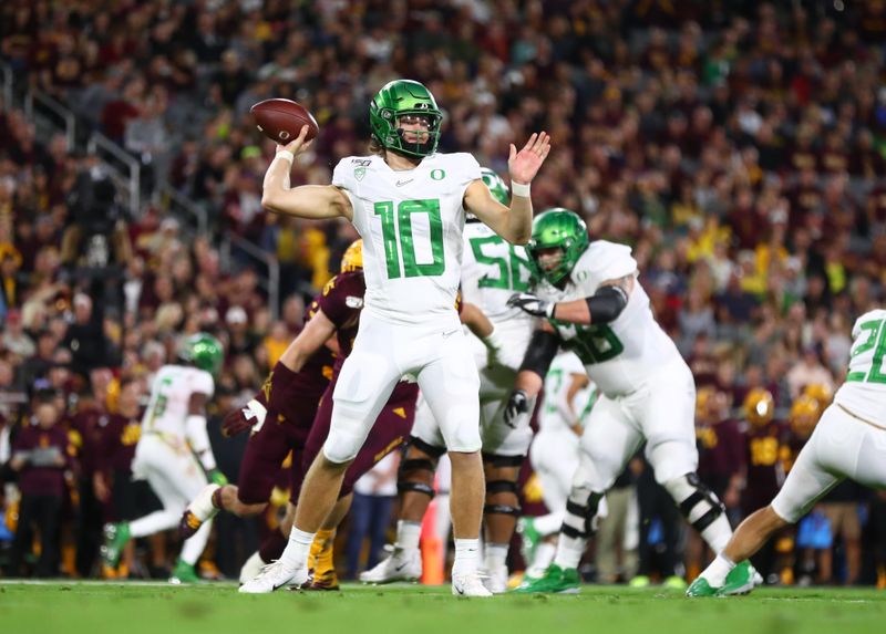 Nov 23, 2019; Tempe, AZ, USA; Oregon Ducks quarterback Justin Herbert (10) against the Arizona State Sun Devils in the first half at Sun Devil Stadium. Mandatory Credit: Mark J. Rebilas-USA TODAY Sports