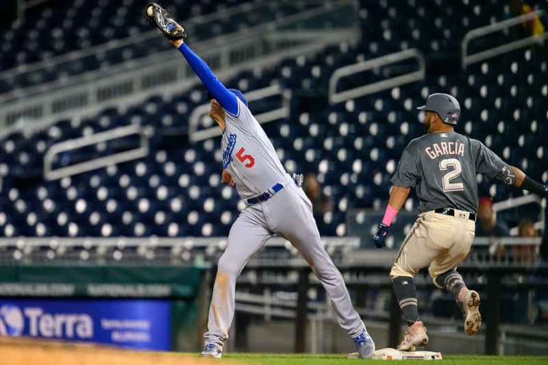 Sep 8, 2023; Washington, District of Columbia, USA; Los Angeles Dodgers first baseman Freddie Freeman (5) makes a catch for an out during the seventh inning against the Washington Nationals at Nationals Park. Mandatory Credit: Reggie Hildred-USA TODAY Sports