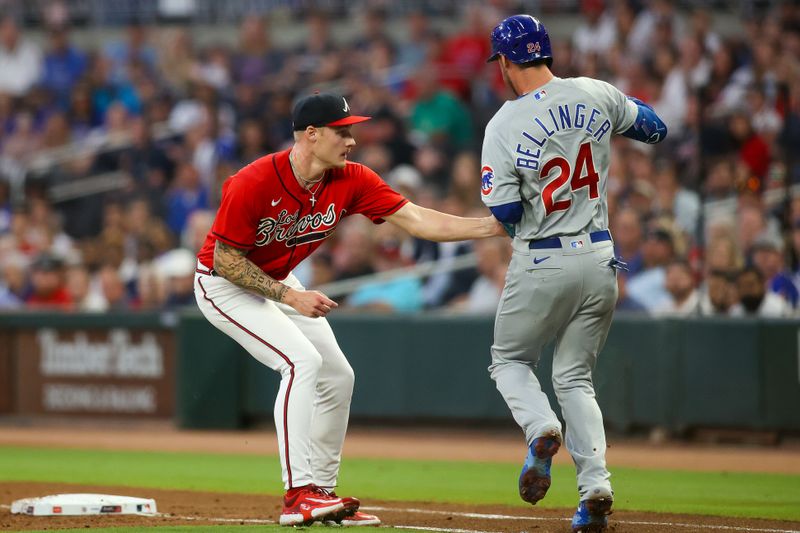 Sep 28, 2023; Atlanta, Georgia, USA; Atlanta Braves starting pitcher AJ Smith-Shawver (62) tags out Chicago Cubs first baseman Cody Bellinger (24) in the first inning at Truist Park. Mandatory Credit: Brett Davis-USA TODAY Sports
