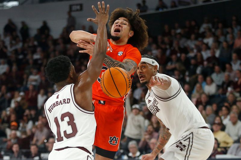 Jan 27, 2024; Starkville, Mississippi, USA; Auburn Tigers guard Tre Donaldson (3) looses control of the ball as Mississippi State Bulldogs guard Josh Hubbard (13) and forward Tolu Smith (1) defend during the first half at Humphrey Coliseum. Mandatory Credit: Petre Thomas-USA TODAY Sports