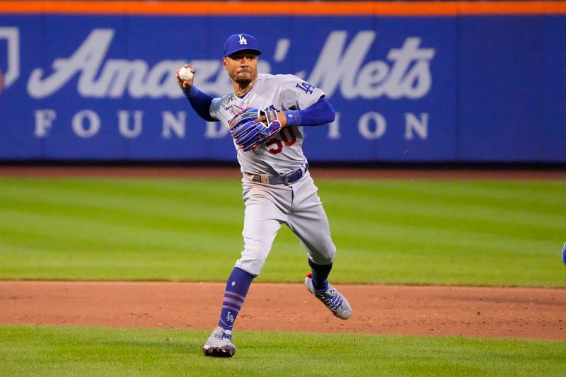 Jul 16, 2023; New York City, New York, USA; Los Angeles Dodgers second baseman Mookie Betts (50) throws out New York Mets shortstop Francisco Lindor (not pictured) after fielding a ground ball during the eighth inning at Citi Field. Mandatory Credit: Gregory Fisher-USA TODAY Sports