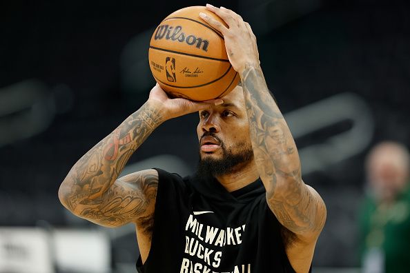 MILWAUKEE, WISCONSIN - DECEMBER 17: Damian Lillard #0 of the Milwaukee Bucks warms up before the game against the Houston Rockets at Fiserv Forum on December 17, 2023 in Milwaukee, Wisconsin. NOTE TO USER: User expressly acknowledges and agrees that, by downloading and or using this photograph, User is consenting to the terms and conditions of the Getty Images License Agreement. (Photo by John Fisher/Getty Images)