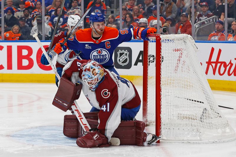 Apr 13, 2026; Edmonton, Alberta, CAN; Edmonton Oilers forward Connor McDavid (97) looks for a rebound as Colorado Avalanche goaltender Scott Wedgewood (41) covers up a loose puck during the third period  at Rogers Place. Mandatory Credit: Perry Nelson-Imagn Images