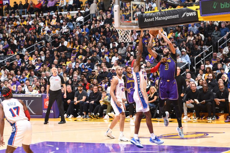 LOS ANGELES, CA - MARCH 22: Anthony Davis #3 of the Los Angeles Lakers shoots the ball during the game against the Philadelphia 76ers on March 22, 2024 at Crypto.Com Arena in Los Angeles, California. NOTE TO USER: User expressly acknowledges and agrees that, by downloading and/or using this Photograph, user is consenting to the terms and conditions of the Getty Images License Agreement. Mandatory Copyright Notice: Copyright 2024 NBAE (Photo by Adam Pantozzi/NBAE via Getty Images)