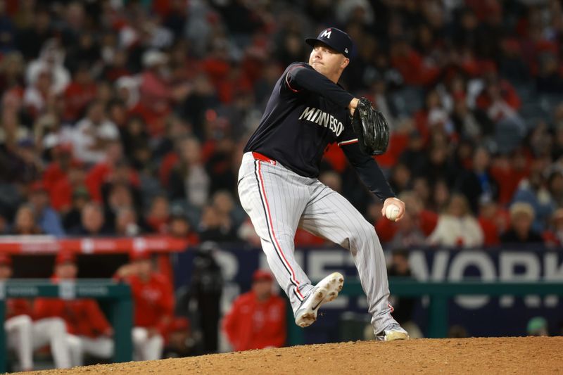 Apr 26, 2024; Anaheim, California, USA;  Minnesota Twins pitcher Caleb Thielbar (56) pitches during the ninth inning against the Los Angeles Angels at Angel Stadium. Mandatory Credit: Kiyoshi Mio-USA TODAY Sports