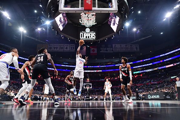 LOS ANGELES, CA - DECEMBER 11: Norman Powell #24 of the LA Clippers drives to the basket during the game against the Portland Trail Blazers on December 11, 2023 at Crypto.Com Arena in Los Angeles, California. NOTE TO USER: User expressly acknowledges and agrees that, by downloading and/or using this Photograph, user is consenting to the terms and conditions of the Getty Images License Agreement. Mandatory Copyright Notice: Copyright 2023 NBAE (Photo by Adam Pantozzi/NBAE via Getty Images)