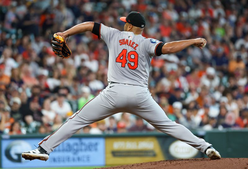 Jun 23, 2024; Houston, Texas, USA;  Baltimore Orioles starting pitcher Albert Suarez (49) pitches against the Houston Astros in the first inning at Minute Maid Park. Mandatory Credit: Thomas Shea-USA TODAY Sports