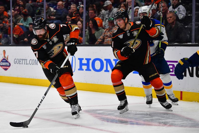 Apr 7, 2024; Anaheim, California, USA; Anaheim Ducks defenseman Radko Gudas (7) moves the puck against the St. Louis Blues during the third period at Honda Center. Mandatory Credit: Gary A. Vasquez-USA TODAY Sports