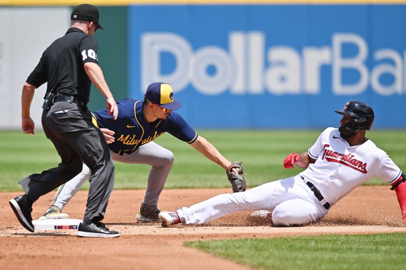 Jun 25, 2023; Cleveland, Ohio, USA; Milwaukee Brewers shortstop Willy Adames (27) tags out Cleveland Guardians shortstop Amed Rosario (1) during the first inning at Progressive Field. Mandatory Credit: Ken Blaze-USA TODAY Sports