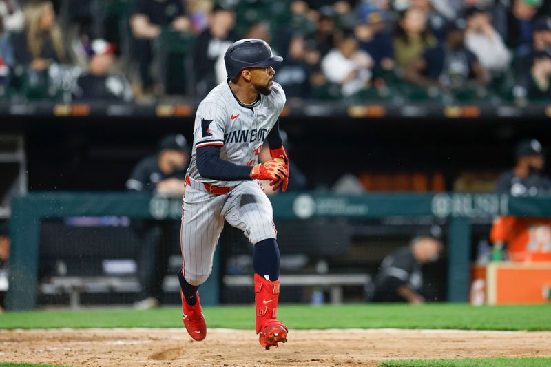 Apr 29, 2024; Chicago, Illinois, USA; Minnesota Twins outfielder Byron Buxton (25) watches his double against the Chicago White Sox during the ninth inning at Guaranteed Rate Field. Mandatory Credit: Kamil Krzaczynski-USA TODAY Sports