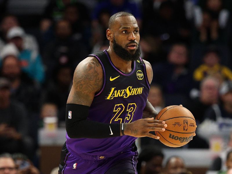 MINNEAPOLIS, MINNESOTA - DECEMBER 02: LeBron James #23 of the Los Angeles Lakers dribbles the ball against the Minnesota Timberwolves in the third quarter at Target Center on December 02, 2024 in Minneapolis, Minnesota. The Timberwolves defeated the Lakers 109-80. NOTE TO USER: User expressly acknowledges and agrees that, by downloading and or using this photograph, User is consenting to the terms and conditions of the Getty Images License Agreement. (Photo by David Berding/Getty Images)