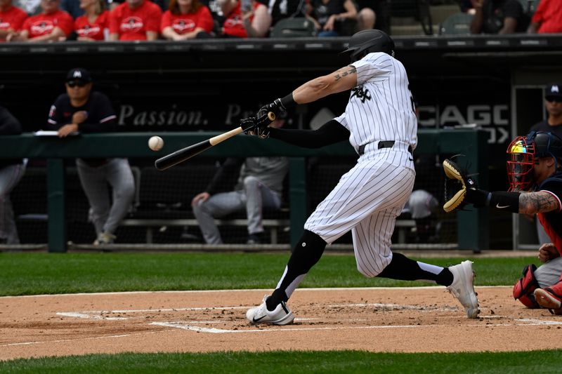 May 1, 2024; Chicago, Illinois, USA; Chicago White Sox outfielder Tommy Pham (28) hits an RBI double against the Minnesota Twins during the first inning at Guaranteed Rate Field. Mandatory Credit: Matt Marton-USA TODAY Sports