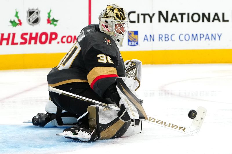 Dec 10, 2023; Las Vegas, Nevada, USA; Vegas Golden Knights goaltender Jiri Patera (30) makes a save against the San Jose Sharks during the third period at T-Mobile Arena. Mandatory Credit: Stephen R. Sylvanie-USA TODAY Sports