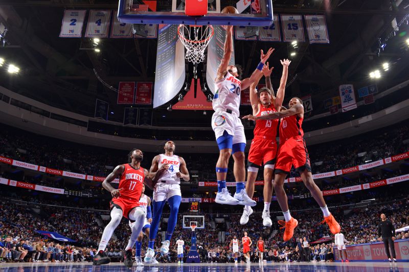 PHILADELPHIA, PA - NOVEMBER 27: Jared McCain #20 of the Philadelphia 76ers drives to the basket during the game against the Houston Rockets on November 27, 2024 at the Wells Fargo Center in Philadelphia, Pennsylvania NOTE TO USER: User expressly acknowledges and agrees that, by downloading and/or using this Photograph, user is consenting to the terms and conditions of the Getty Images License Agreement. Mandatory Copyright Notice: Copyright 2024 NBAE (Photo by Jesse D. Garrabrant/NBAE via Getty Images)