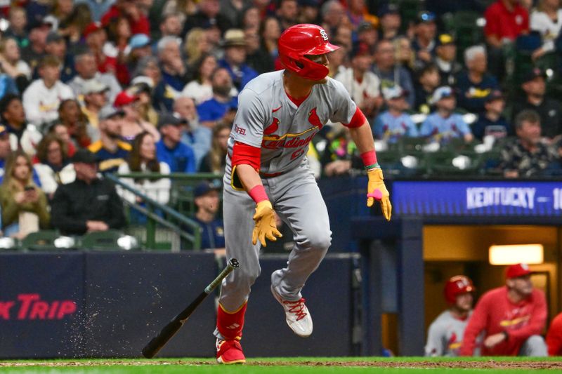 May 11, 2024; Milwaukee, Wisconsin, USA; St. Louis Cardinals center fielder Lars Nootbaar (21) hits a single to drive in two runs against the Milwaukee Brewers in the fifth inning at American Family Field. Mandatory Credit: Benny Sieu-USA TODAY Sports