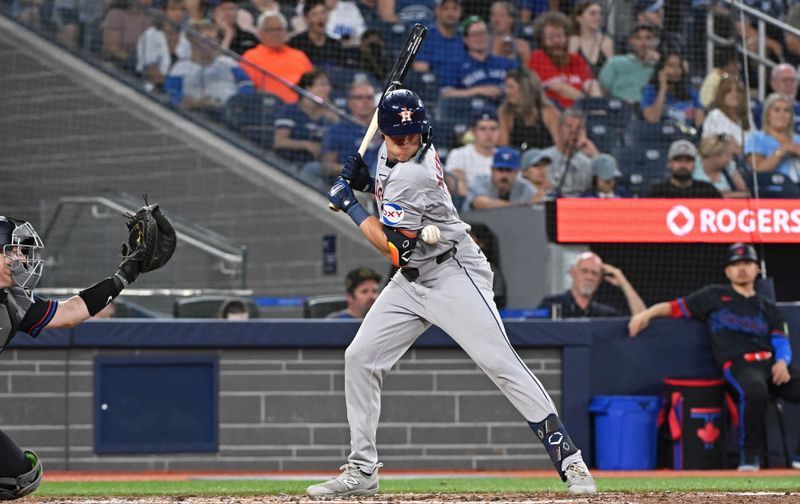 Jul 3, 2024; Toronto, Ontario, CAN; Houston Astros center fielder Jake Myers (6) is hit by a pitch in the seventh inning against the Toronto Blue Jays at Rogers Centre. Mandatory Credit: Gerry Angus-USA TODAY Sports