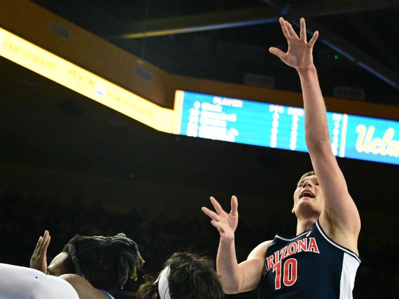 Mar 4, 2023; Los Angeles, California, USA;  Arizona Wildcats forward Azuolas Tubelis (10) shoots the ball as UCLA Bruins guard Jaime Jaquez Jr. (24) defends during the first half at Pauley Pavilion presented by Wescom. Mandatory Credit: Richard Mackson-USA TODAY Sports