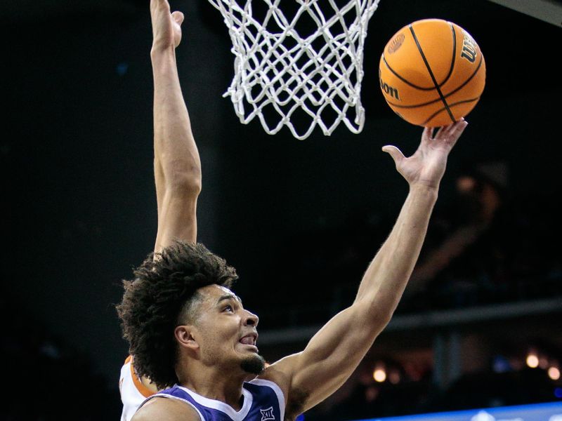 Mar 10, 2023; Kansas City, MO, USA; Texas Longhorns forward Timmy Allen (0) puts up a shot during the second half against the Texas Longhorns at T-Mobile Center. Mandatory Credit: William Purnell-USA TODAY Sports