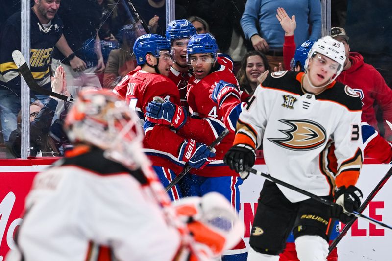 Feb 13, 2024; Montreal, Quebec, CAN; Montreal Canadiens center Nick Suzuki (14) celebrates his first goal of the game against the Anaheim Ducks with his teammates during the second period at Bell Centre. Mandatory Credit: David Kirouac-USA TODAY Sports