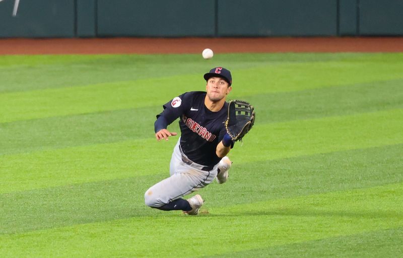 May 14, 2024; Arlington, Texas, USA;  Cleveland Guardians center fielder Tyler Freeman (2) makes a diving catch during the sixth inning against the Texas Rangers at Globe Life Field. Mandatory Credit: Kevin Jairaj-USA TODAY Sports