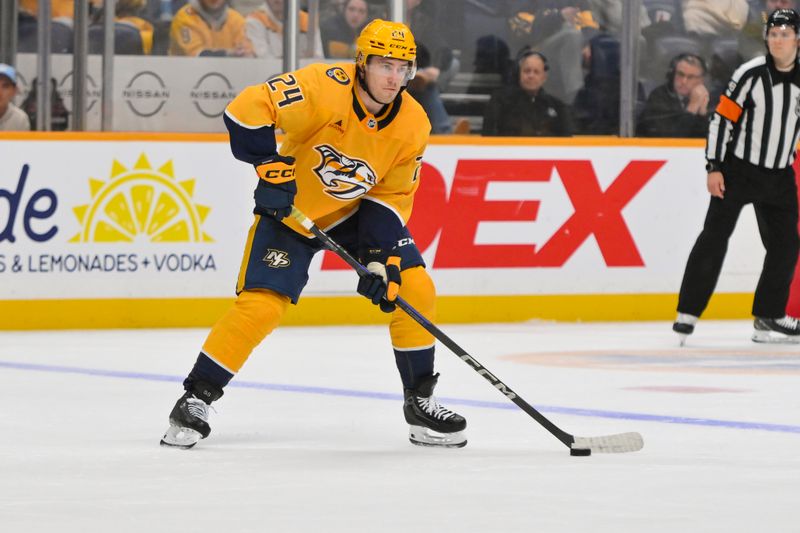 Oct 28, 2025; Nashville, Tennessee, USA;  Nashville Predators defenseman Spencer Stastney (24) skates with the puck against the Tampa Bay Lightning during the third period at Bridgestone Arena. Mandatory Credit: Steve Roberts-Imagn Images