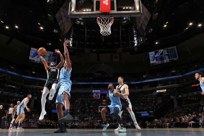 MEMPHIS, TN - APRIL 9: Julian Champagnie #30 of the San Antonio Spurs drives to the basket during the game against the Memphis Grizzlies on April 9, 2024 at FedExForum in Memphis, Tennessee. NOTE TO USER: User expressly acknowledges and agrees that, by downloading and or using this photograph, User is consenting to the terms and conditions of the Getty Images License Agreement. Mandatory Copyright Notice: Copyright 2024 NBAE (Photo by Joe Murphy/NBAE via Getty Images)