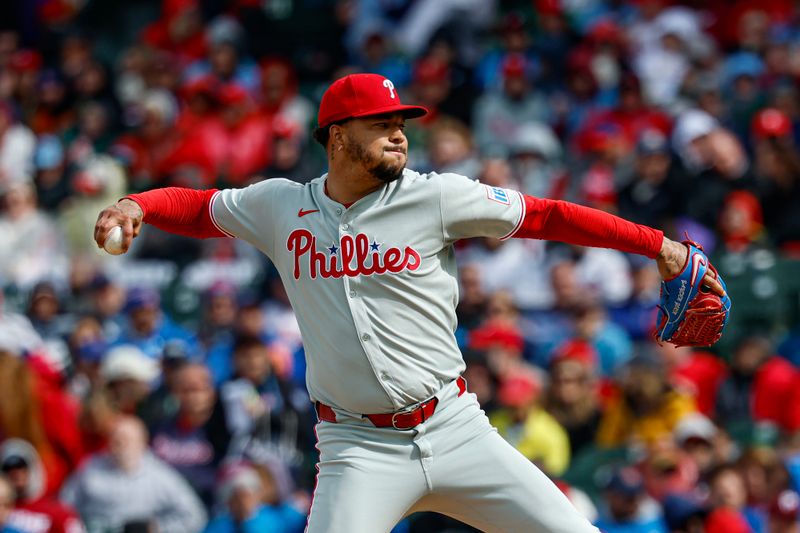 Apr 25, 2025; Chicago, Illinois, USA; Philadelphia Phillies starting pitcher Taijuan Walker (99) delivers a pitch against the Chicago Cubs during the first inning at Wrigley Field. Mandatory Credit: Kamil Krzaczynski-Imagn Images