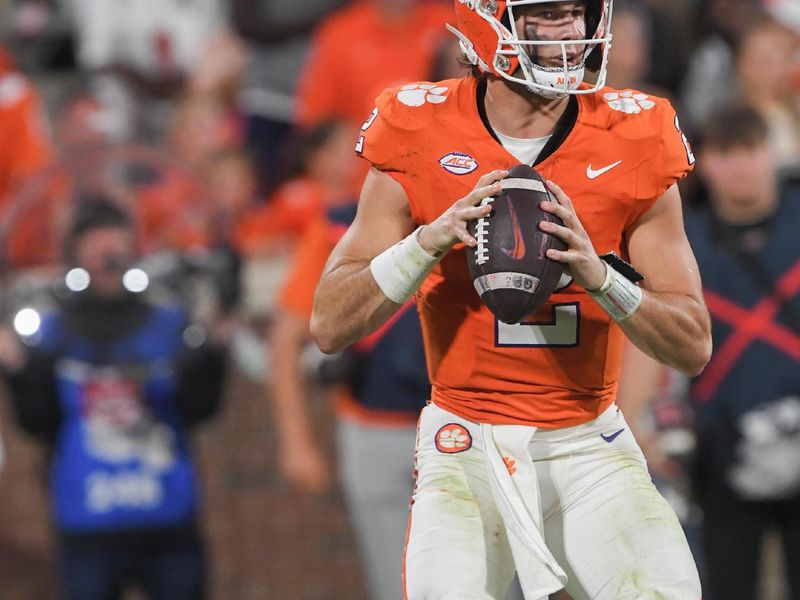 Nov 2, 2024; Clemson, South Carolina, USA; Clemson Tigers quarterback Cade Klubnik (2) drops back to pass against the Louisville Cardinals during the second quarter at Memorial Stadium. Mandatory Credit: Ken Ruinard-Imagn Images