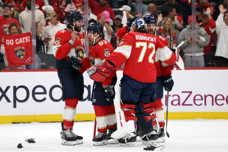 May 11, 2025; Sunrise, Florida, USA; Florida Panthers goaltender Sergei Bobrovsky (72), defenseman Aaron Ekblad (5), center Brad Marchand (63) and center Sam Reinhart (13) celebrate after they beat the Toronto Maple Leafs in game four of the second round of the 2025 Stanley Cup Playoffs at Amerant Bank Arena. Mandatory Credit: Kim Klement Neitzel-Imagn Images