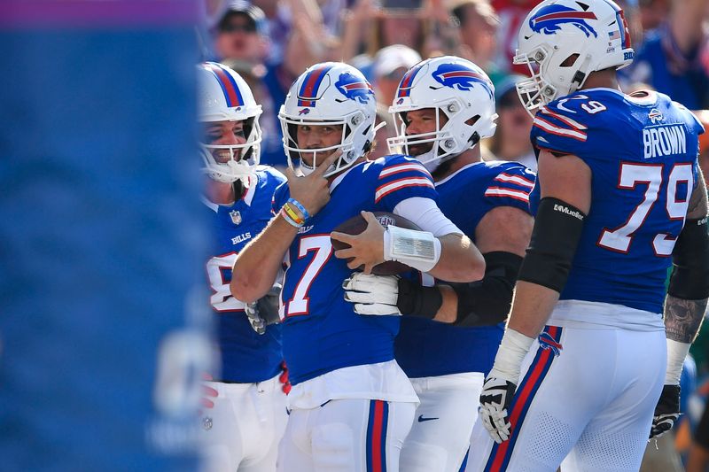 Buffalo Bills quarterback Josh Allen (17) celebrates after his touchdown during the second half of an NFL football game against the Miami Dolphins in Orchard Park, N.Y., Sunday, Oct. 1, 2023. (AP Photo/Adrian Kraus)