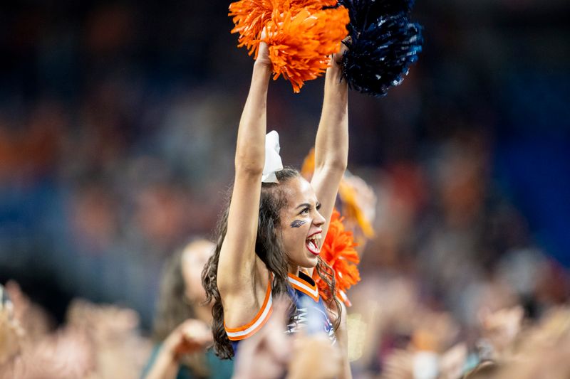 Dec 3, 2021; San Antonio, TX, USA; UTSA Roadrunners cheerleaders celebrate on the field with fans after the Roadrunners defeated the Western Kentucky Hilltoppers 49-41 in the Conference USA championship game the Alamodome. Mandatory Credit: Ivan Pierre Aguirre-USA TODAY Sports